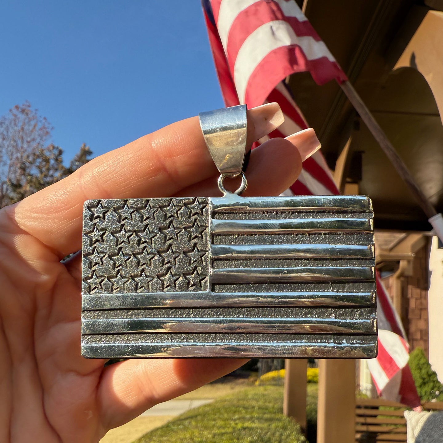 Stanford Yazzie USA Flag Pendant – Bringing West East