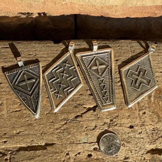Stanford Yazzie Tufacast Pendants
