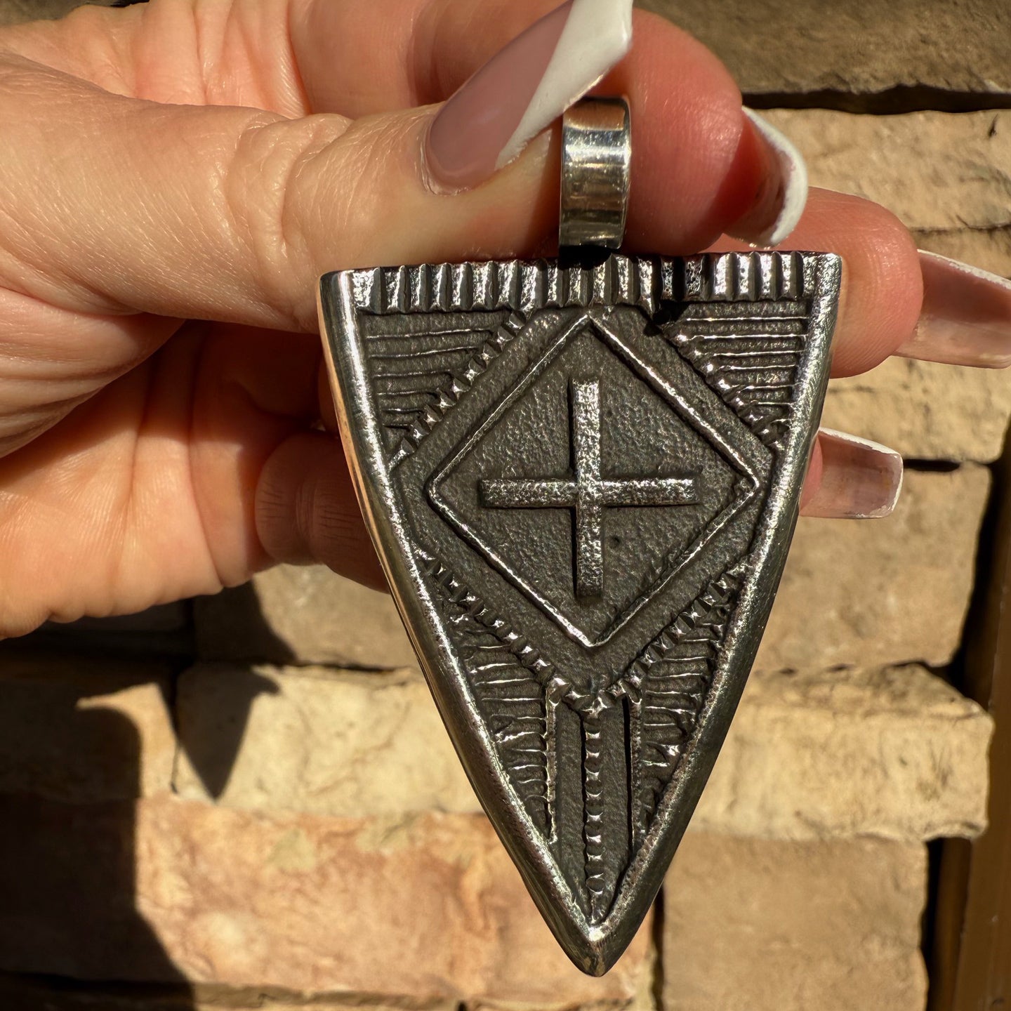 Stanford Yazzie Tufacast Pendants